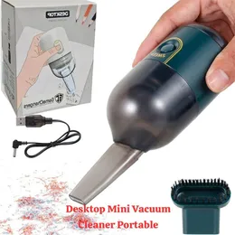portable mini desktop vacuum cleaner with a USB charging cable