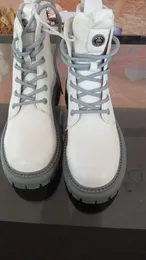 Lace-up ankle boots feature a gray thick-treaded sole
