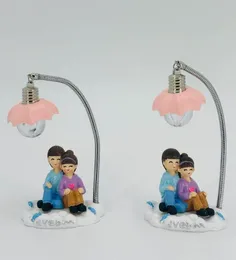 Couple statue with a built-in LED lamp