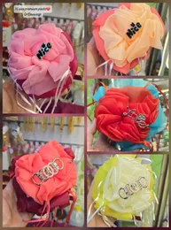 Xl size chiffon hair flower accessories with various embellishments.