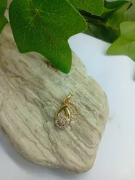 Gold Plated Oval design Pendant with White Stones