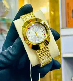 Gold-tone Rado DiaStar Original automatic watch with a blue dial and diamond hour markers.