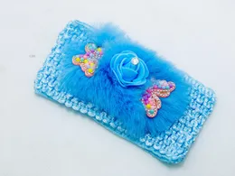 Baby Headband with decorative butterflies and a rose accent.