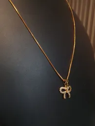 Fashionable Gold-Plated Bow Necklace with Rhinestones