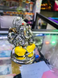 Silver-Plated Ganesha Idol with Yellow Dhoti – Decorative Ganpati Statue for Car, Home & Office