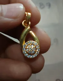 Gold Plated Teardrop Shape and a Swirl of Round-cut Pendant
