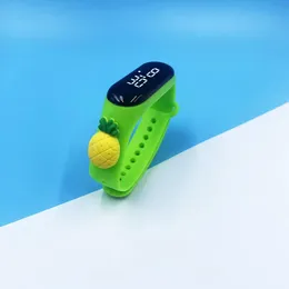 Kids' LED Touch Screen Watch with a Green Silicone Strap Featuring a Pineapple Charm.