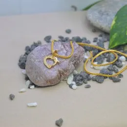 Gold plated 2.2mm fox chain with dolphin heart pendant.