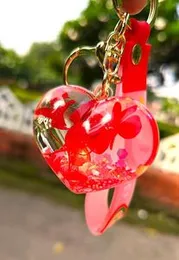 set of acrylic heart-shaped liquid keychains.