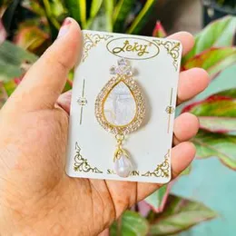 Gold color beautiful water drop mirror type saree brooch with white stone and one pearl drop for women and girl