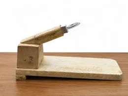 traditional wooden table-top coconut scraper