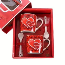 "Love" printed red ceramic couple mug set with spoons.