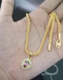 Gold plated chain with  red pendent
