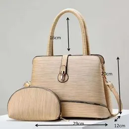 beige women's handbag set, including a top-handle