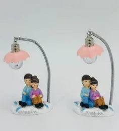 Couple statue with a built-in LED lamp