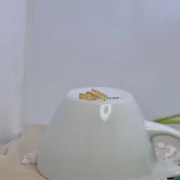 Golden Brass rectangle white stone stud earing.