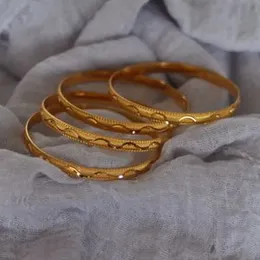 gold plated waves line bngles.