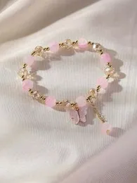 Pinkish crystal with beat butterfly charm bracelet .