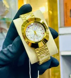 Gold-tone Rado DiaStar Original automatic watch with a blue dial and diamond hour markers.