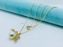 Gold-Tone Layered Necklace with Butterfly Faux Pearl Pendant & Blue Cubic Zirconia for Women