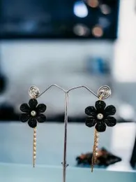 Gold plated stylish beautiful earring with black flower and white stone pearl and gold line drop earring for women and girl