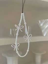 White pearl phone cover keychain with cuteÂ bows