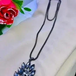 Tanzanite Floral Heart Pendant Necklace (24 Inches) in Platinum Over Sterling Silver.