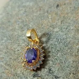gold plated stone pendant.