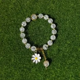 Handcrafted Elegant White Crackle Beads Stretch Bracelet with Cute Flower Charms, Stylish Women's Fashion Jewelry, Perfect Gift Idea