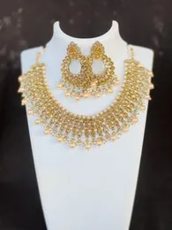 Dull gold rich look beautiful bridle necklace set one pair earring, nalal thali, one necklace with gold and white stone and maroon, white, pink, white