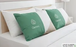 Luxury Glamors pillow covers with a green and white design and a leaf logo