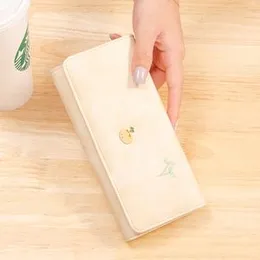 women's wallet with an embroidered fruit and leaf design.