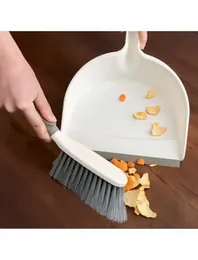 Dustpan with rubber lip and hand brush made of plastic