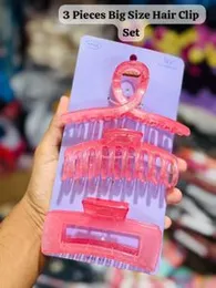 3-pack set of large, pink, transparent claw hair clips.