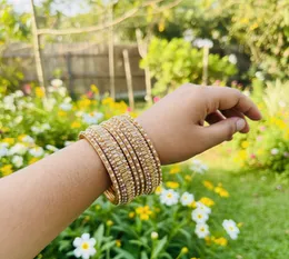 Dull gold color beautiful set bangle with two big bangles, dull gold stone and white pearl for women and girl