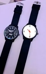 Quartz watches with black silicone straps and round dials