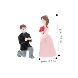 set of miniature proposal couple figurines used as decorative showpieces or wedding cake toppers.