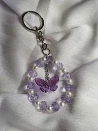 Crystal violet butterfly keychain.