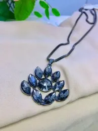 Tanzanite Floral Heart Pendant Necklace (24 Inches) in Platinum Over Sterling Silver.
