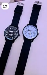 black and white Nike-branded quartz watches with rubber straps.