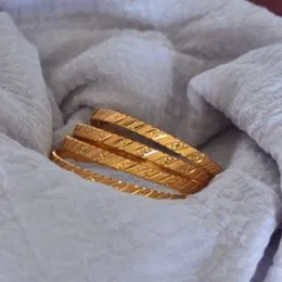 gold plated bangles.