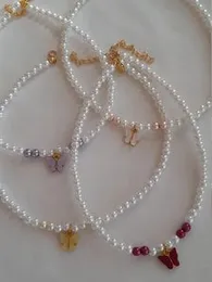 White beats with butterfly charm   Violet  Pink  White  Red.