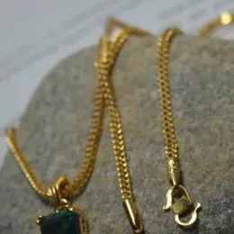 1.9mm fox singapore chain with green stone pendant.