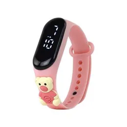 kids' LED digital watch with a pink silicone band and a bear charm