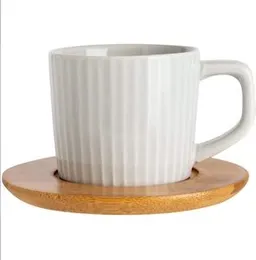 Ceramic Mugs with Bamboo Saucers.
