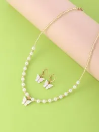 Butterfly charm necklace and drop earrings.