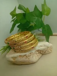 Traditional Gold-Plated Bangles with Red and Green Stones