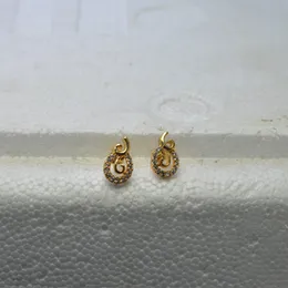 Gold Plated kundan stone and embellished studs earrings.