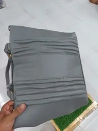 grey clutch bag or purse.