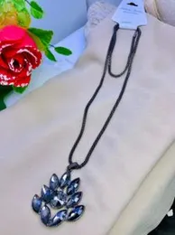 Tanzanite Floral Heart Pendant Necklace (24 Inches) in Platinum Over Sterling Silver.